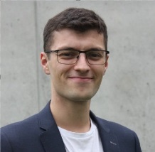 male, smiling, glasses, dark hair